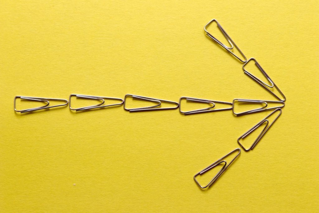 A paperclip arrow is about guidance and helping the perfect team get out of a rut they might be in.  